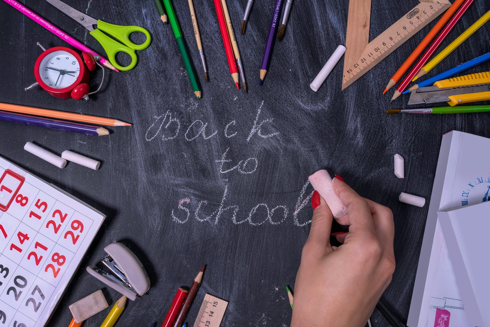 The words Back to School on a chalkboard